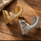 SCULPTED WING CUFF
